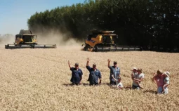Family standing in a field of corn